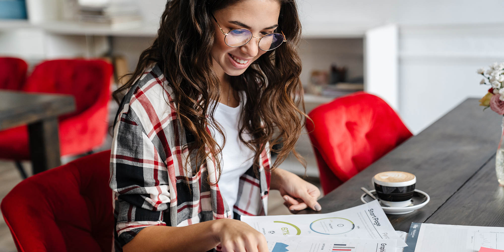 pleased-nice-woman-smiling-and-working-with-papers-KSUC2DV.jpg